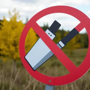 Illustration depicting a no symbol over disposable vapes, surrounded by greenery.