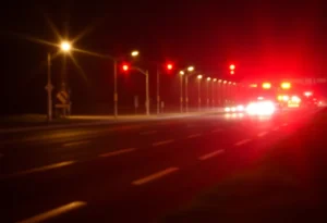 Police and emergency lights at a highway accident scene in Canton Township